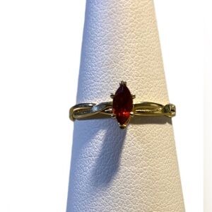 Electroplated GoldTone  5 3/4 size ring with Gemstone Garnet birthstone setting.